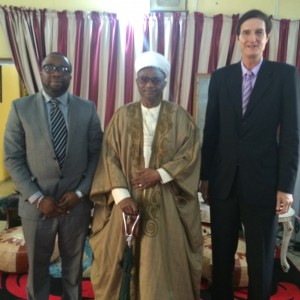 Dennis Obeto, CEO of Salad Greenhouse (Worldwide) Ltd. (left), Peter McAlpine, Marketing Manager of Artemis & Angel Co. Ltd. (right), with His Excellency, the Emir of Bida, at his palace in Bida, Niger State.